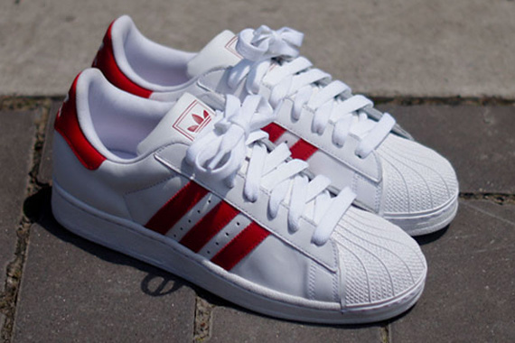 red and white adidas sneakers