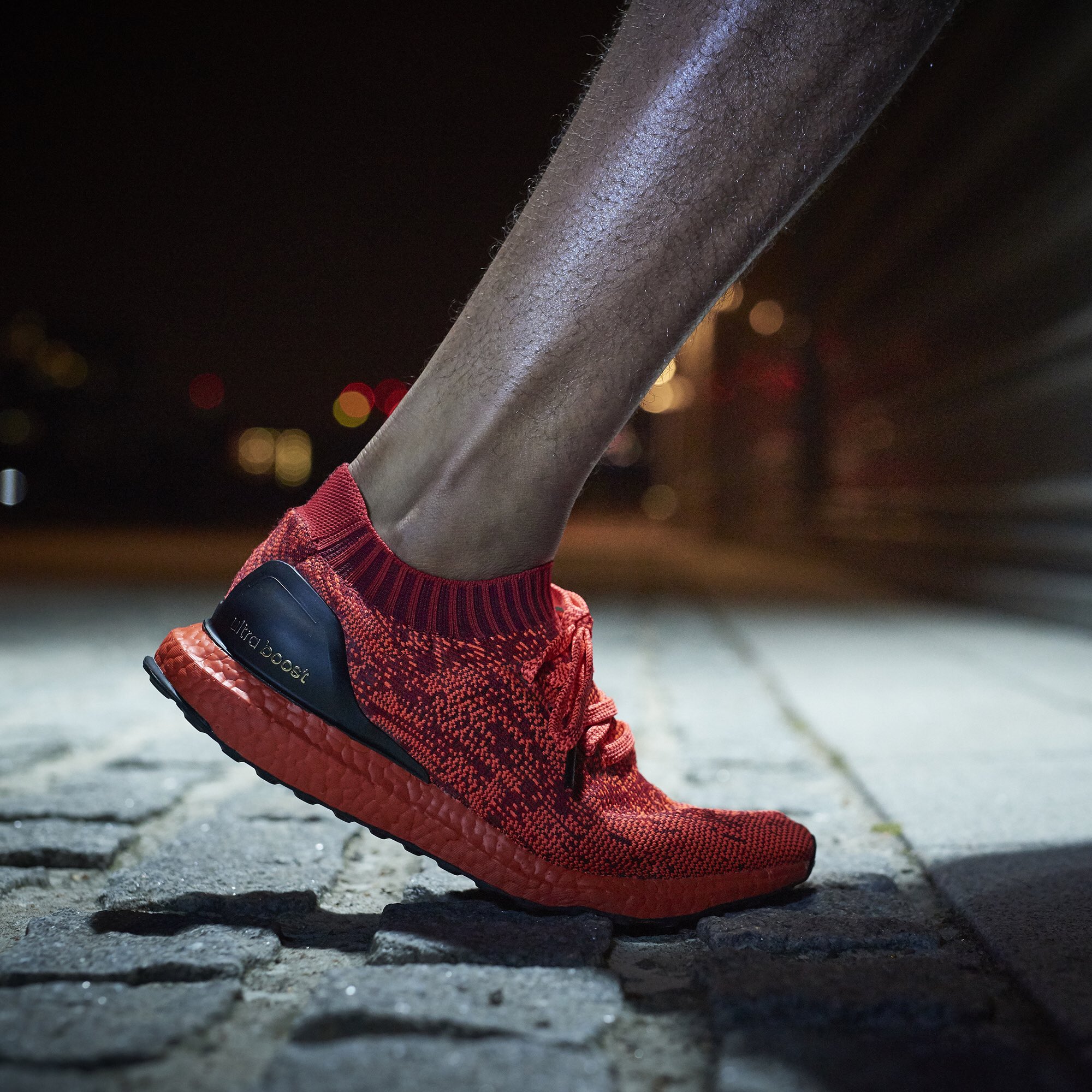 ultra boost uncaged red on feet